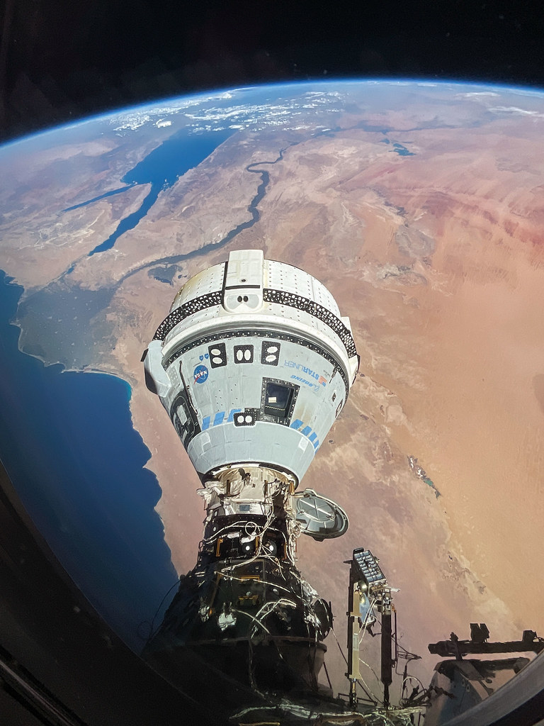 a space capsule above the earth